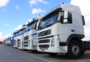 Fleet of commercial trucks lined up